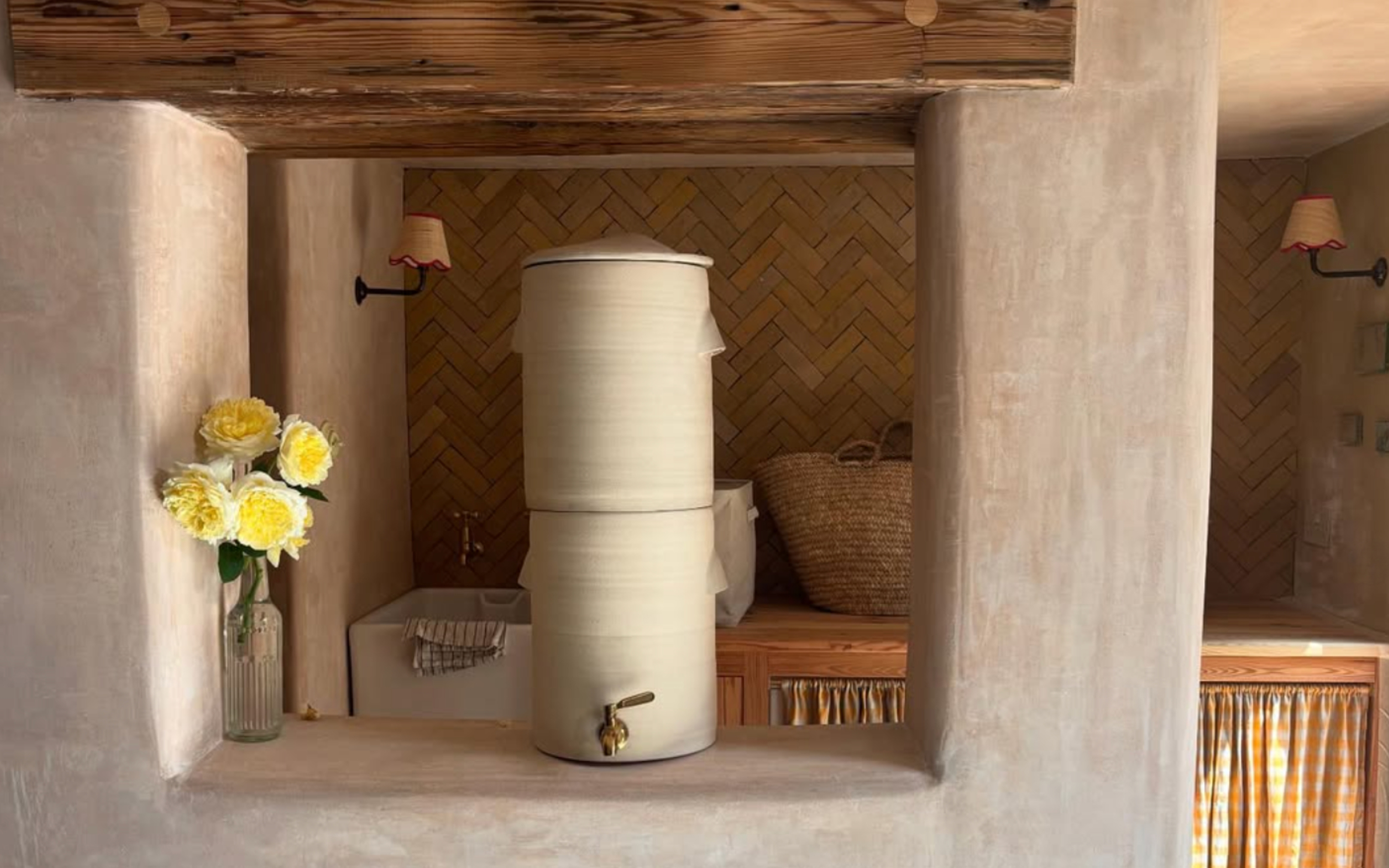 a luxury countertop water filter from Endless Rhythm pictured in ceramic cream in a kitchen