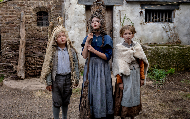 Jacobi Jupe stars as Hamnet, Bodhi Rae Breathnach as Susanna and Olivia Lynes as Judith in Hamnet