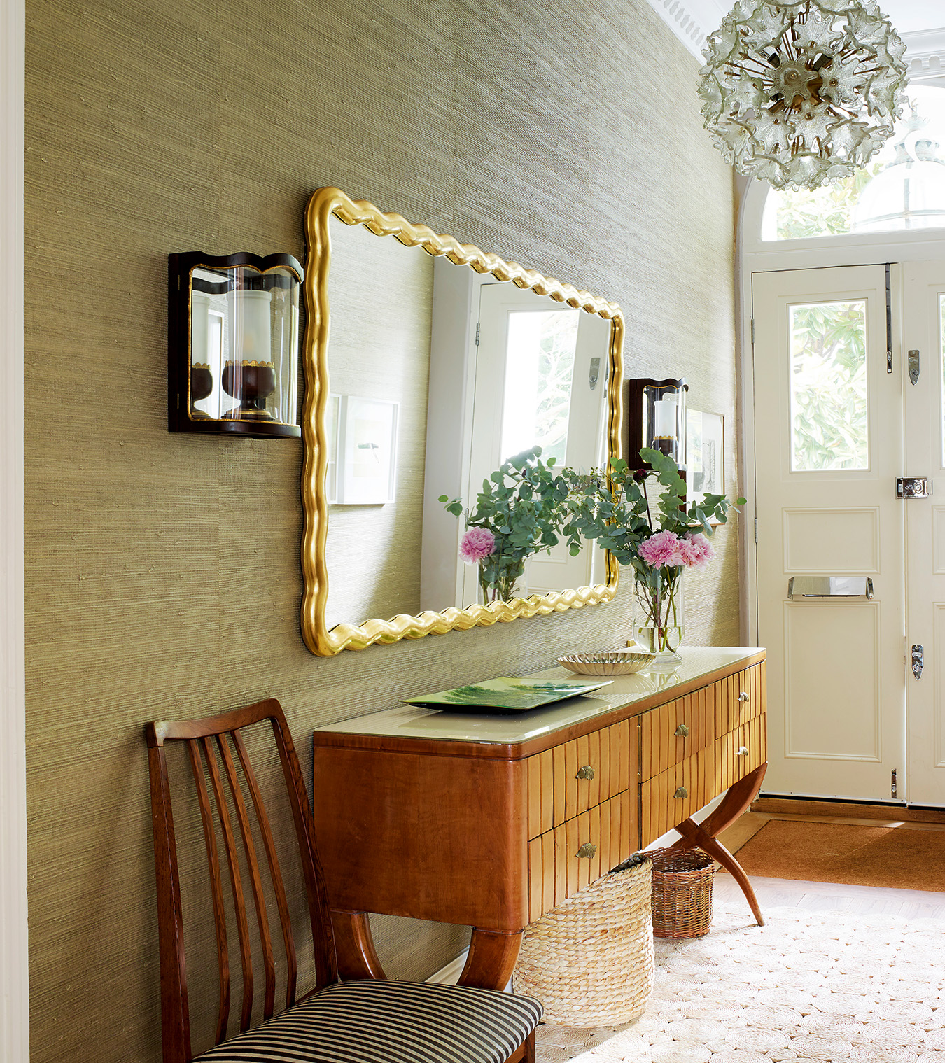 a hallway with a statement miror