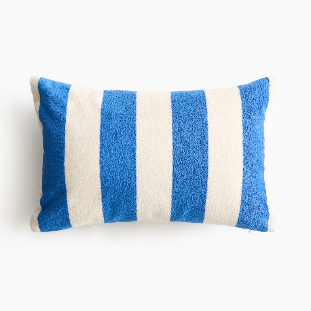 Terry Beach Cushion from h&m pictured on a white background in blue white stripe
