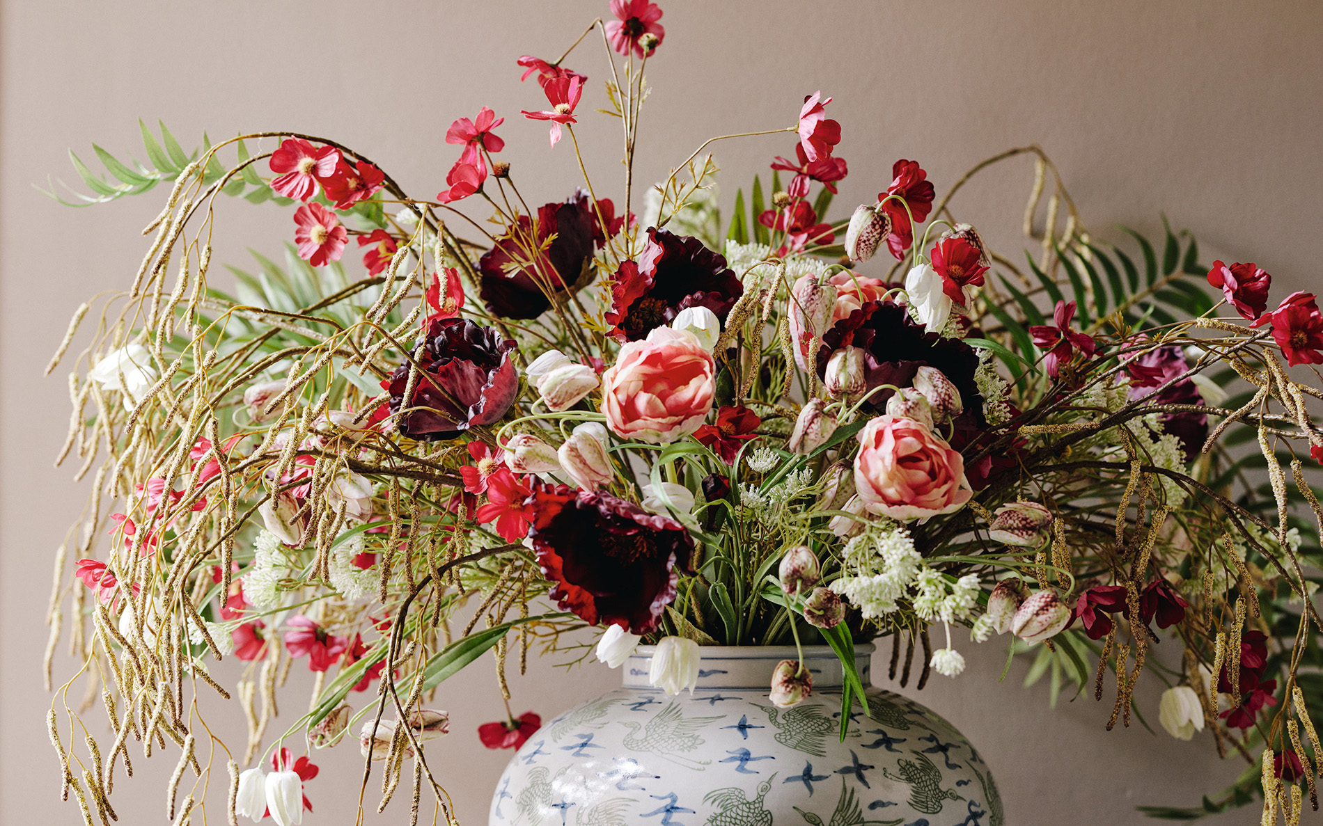 A bunch of faux flowers from OKA in a white vase