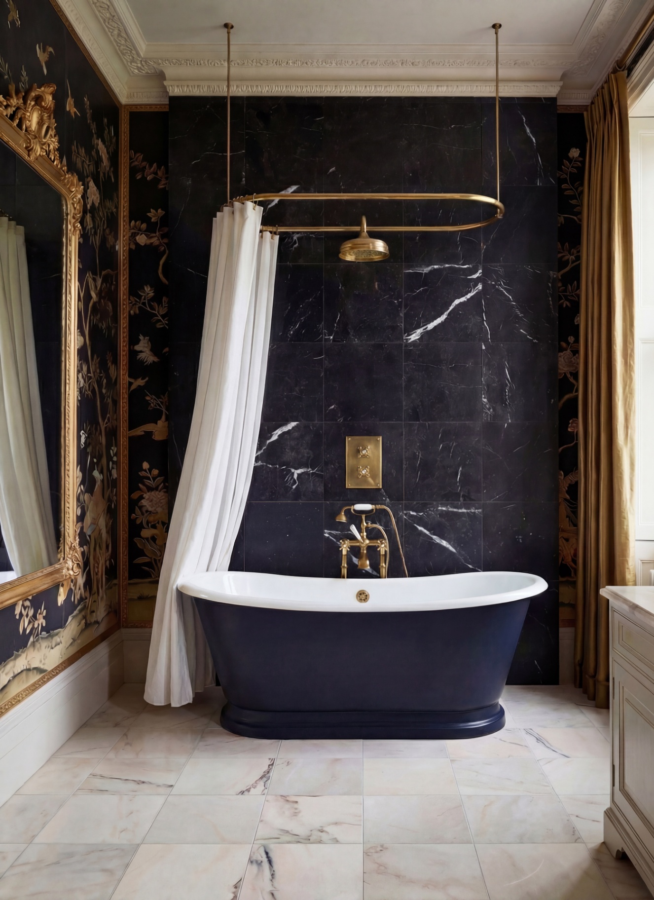 a bathroom with navy wall tiles, cream floor tiles, a freestanding navy bath with a hanging white curtain, brass hardware and a large gilded mirror on the left wall
