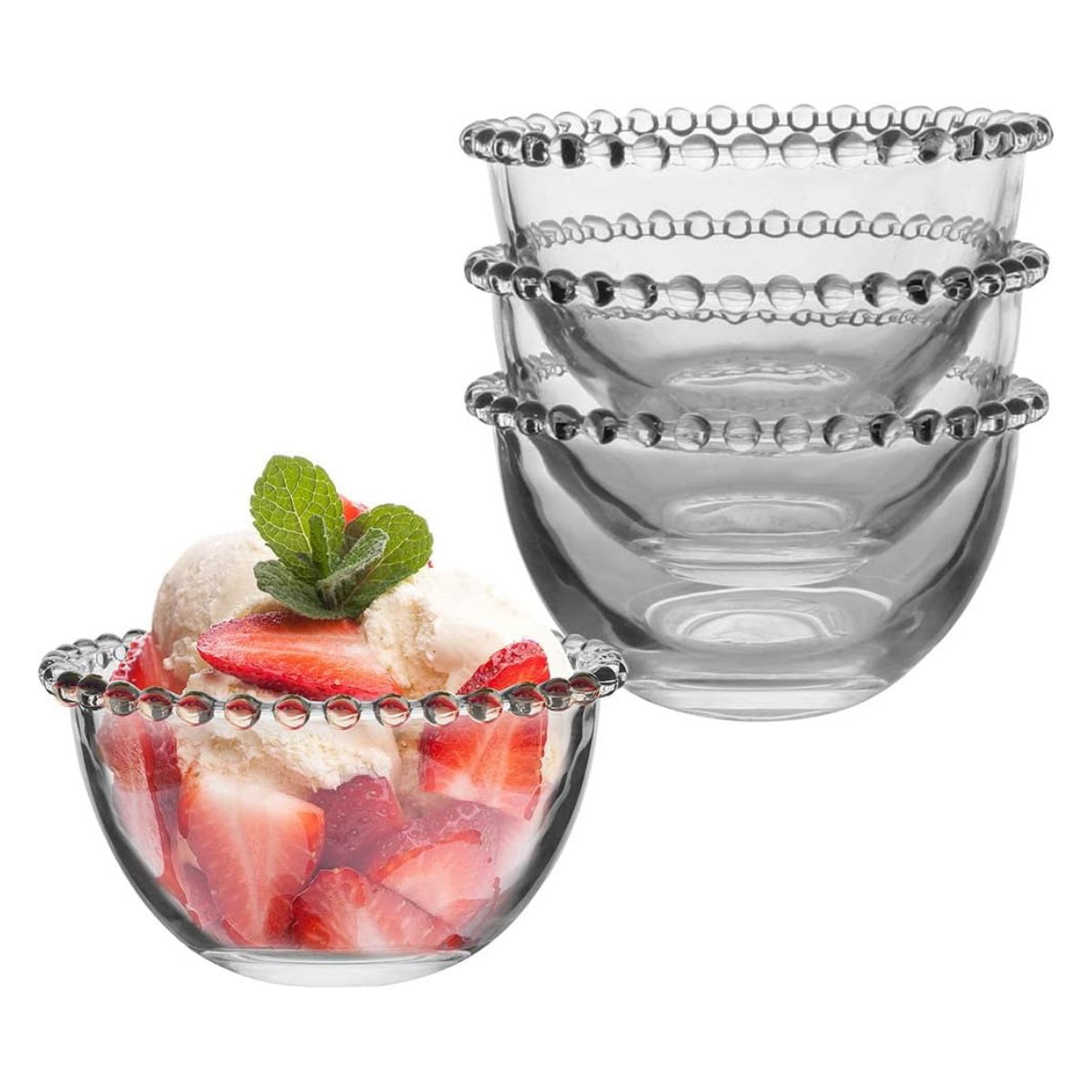 four clear glass dessert bowls with beaded rims, one with ice cream and strawberries inside