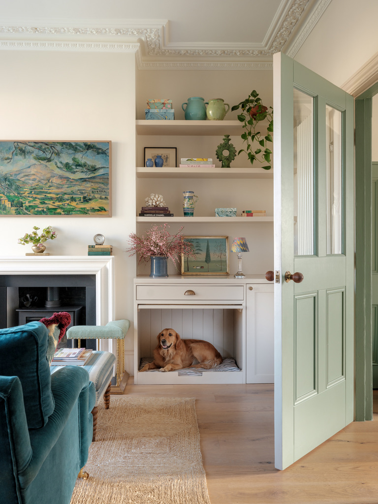 a dog pictured cooling off in a nook in a lovely living room setting