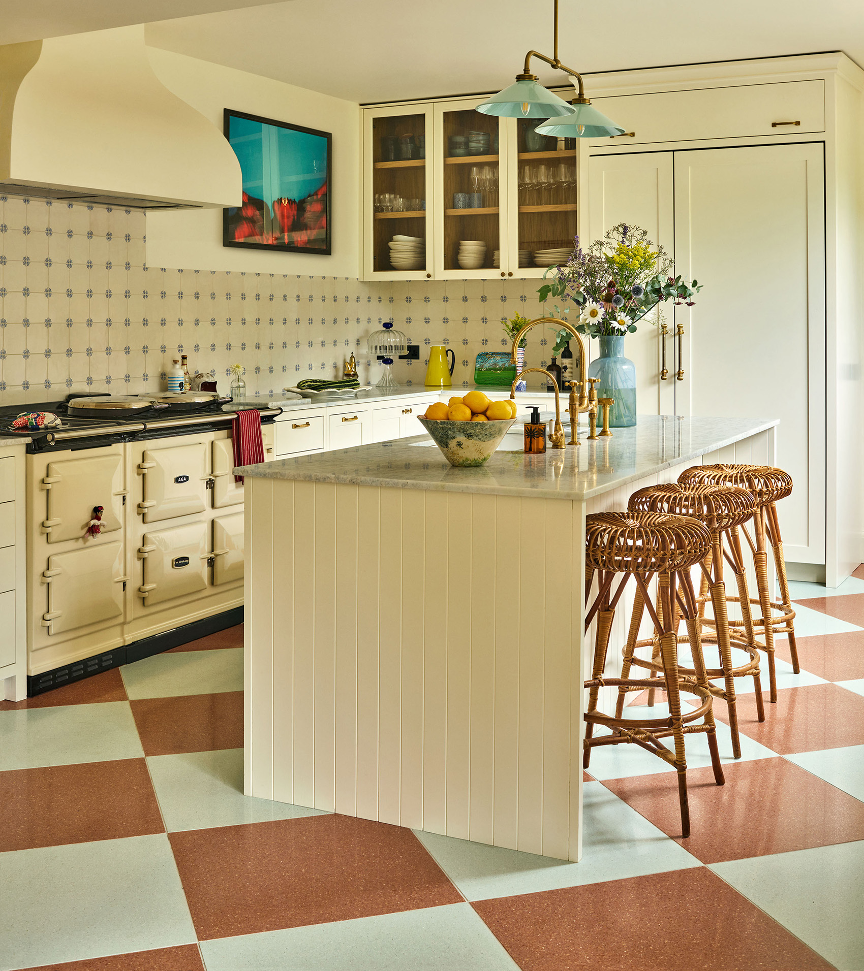 a neutral kitchen with orange and white checkerboard flooring