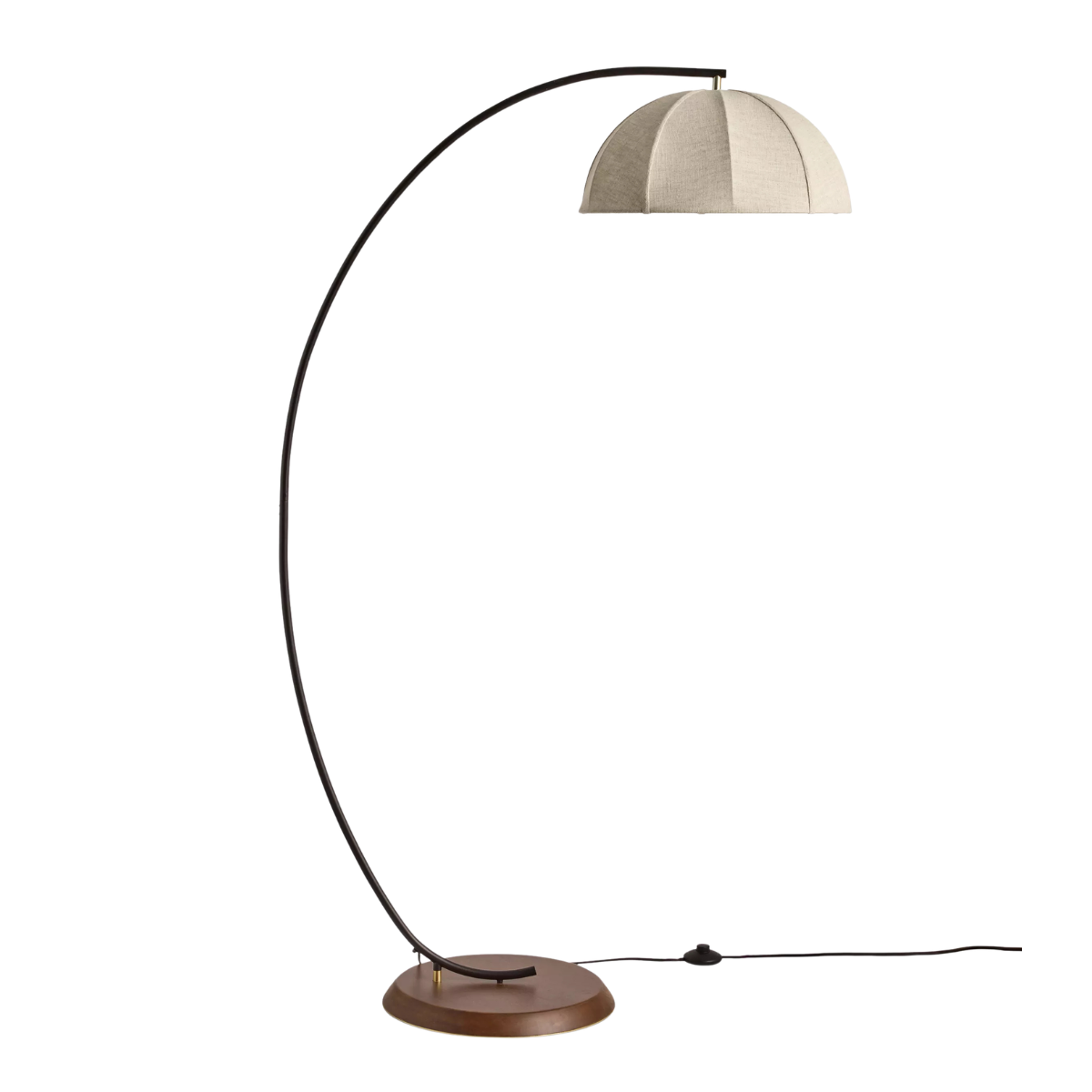a curbed floor lamp with a cream linen shade