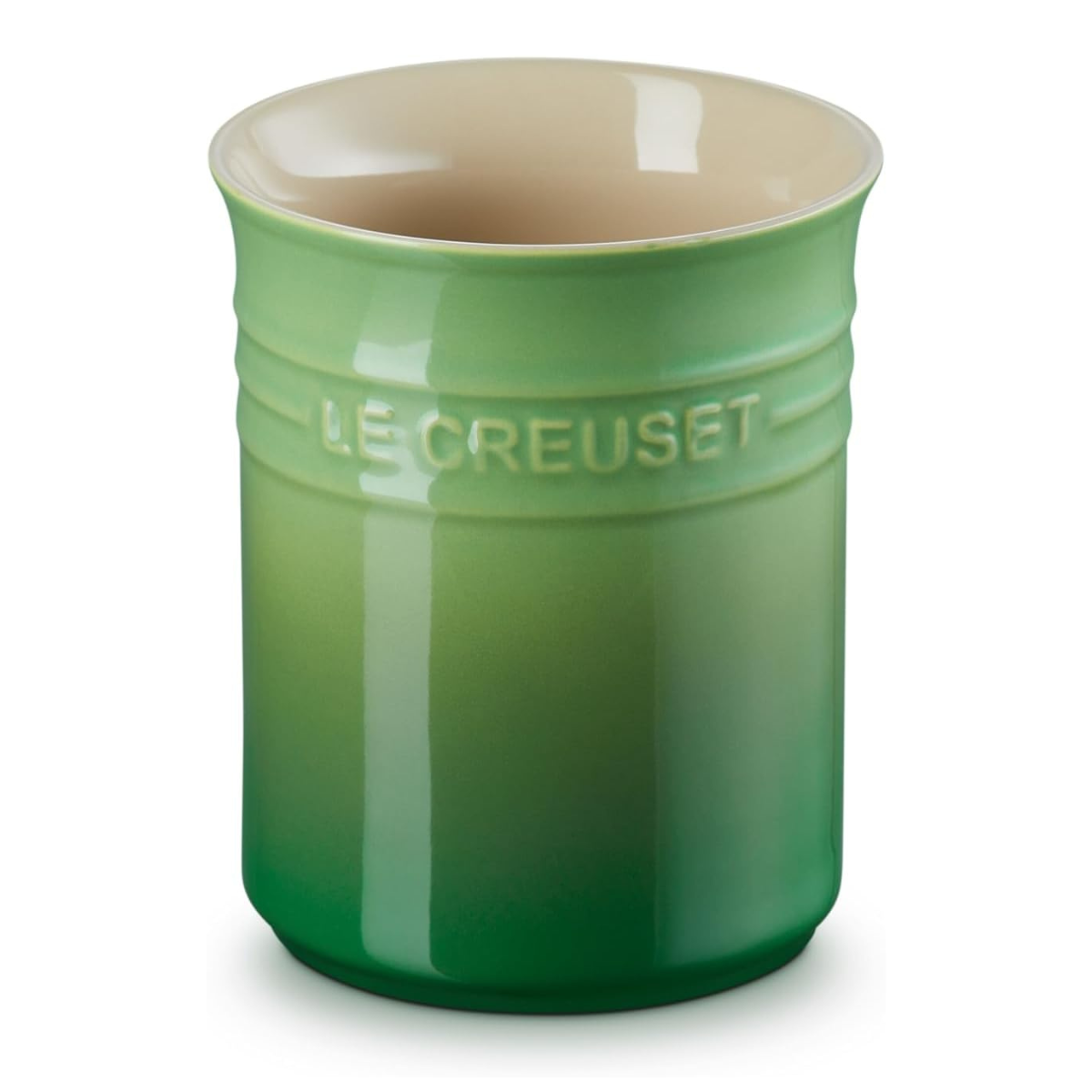 a green le creuset utensil jar