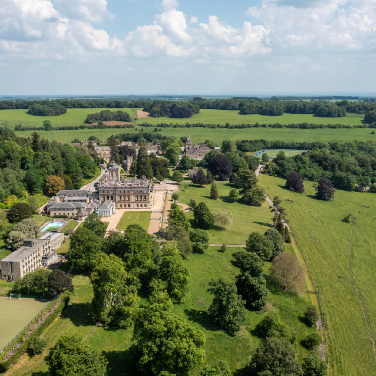 Rendcomb park estate view from above with grand grounds and buildings