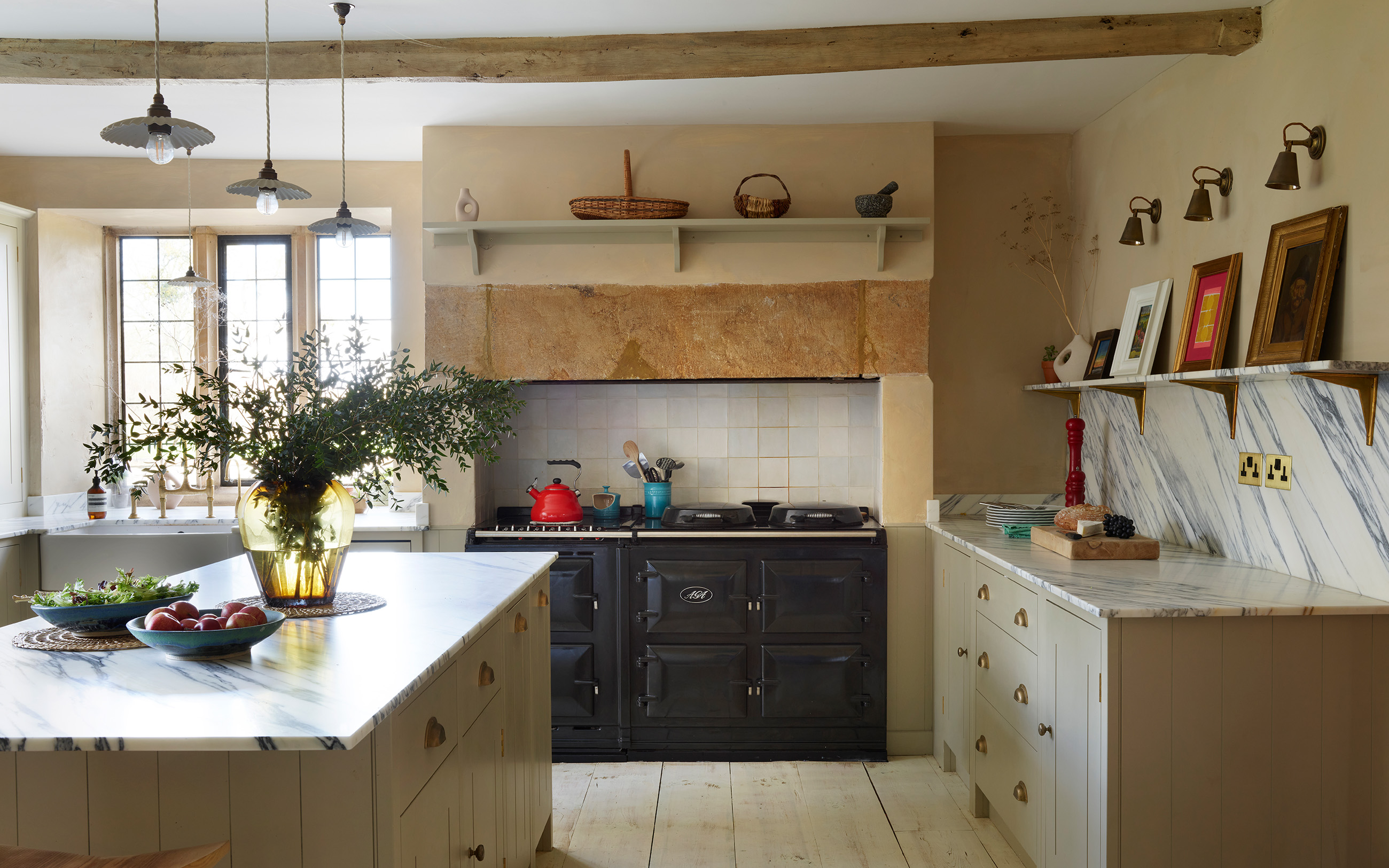 a farmhouse kitchen with a black range cooker