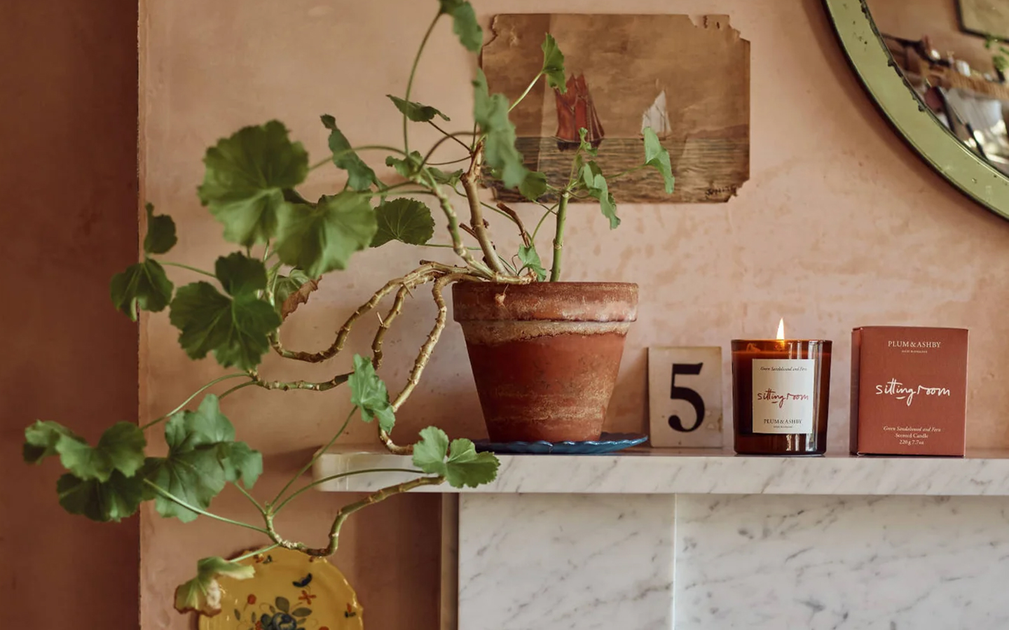 autumn candle on a marble fireplace