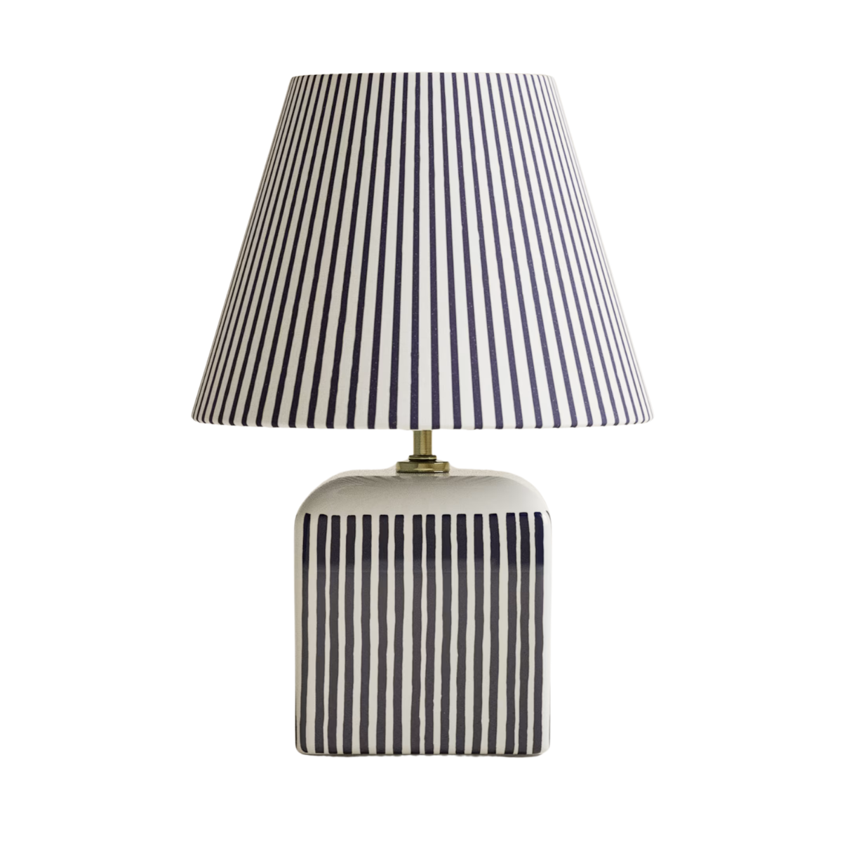 a white and black lamp with an all over pinstripe pattern