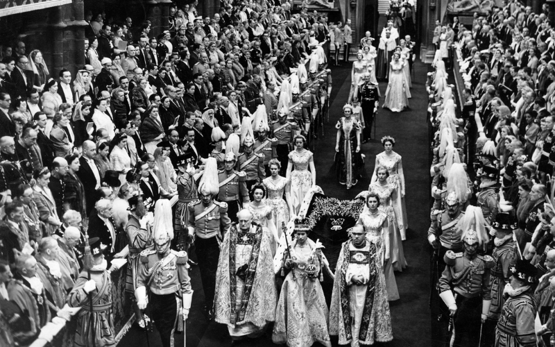 The Queen leads the State Procession down the Nave, followed by her Maids of Honour