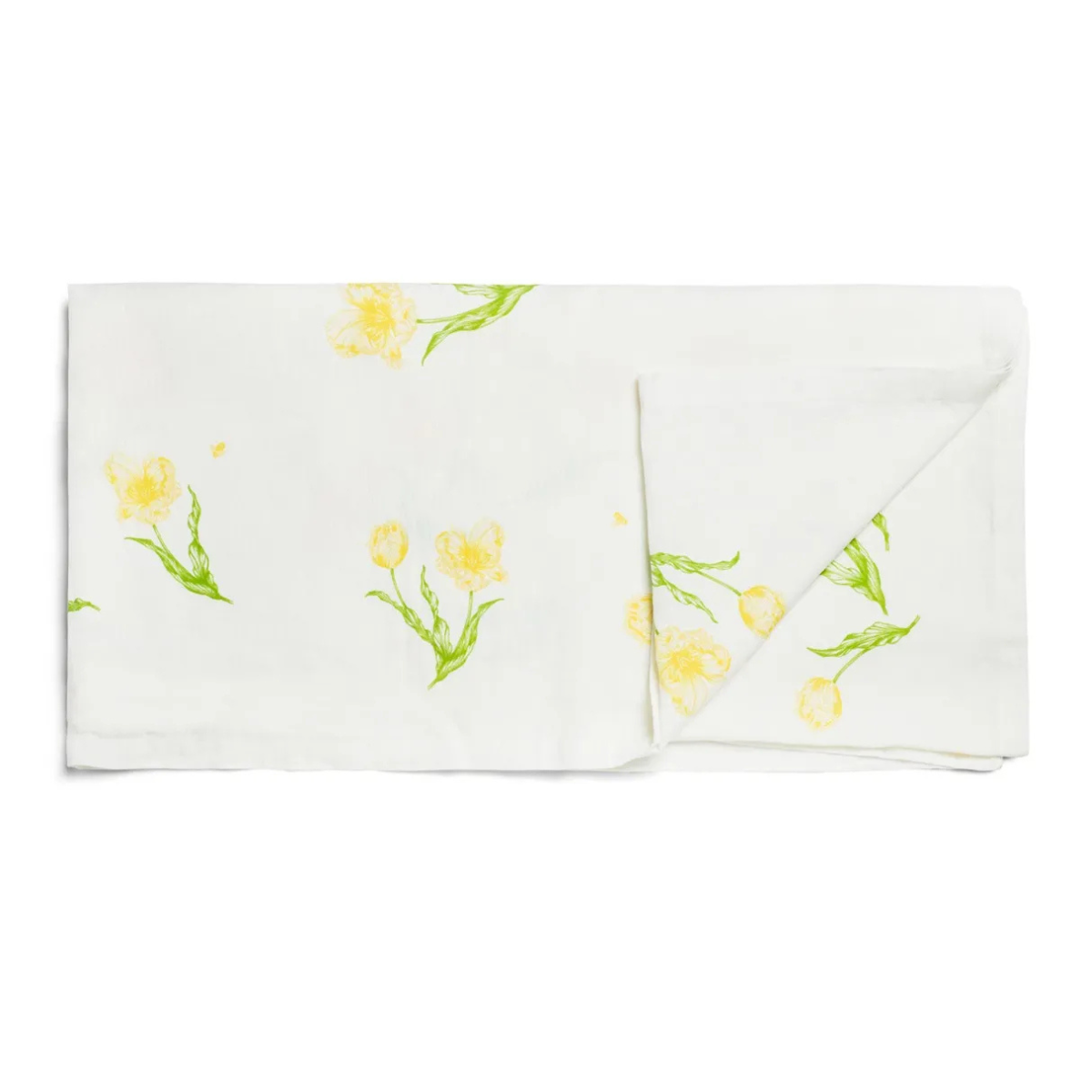 a white tablecloth, folded up, with yellow flowers with green leaves