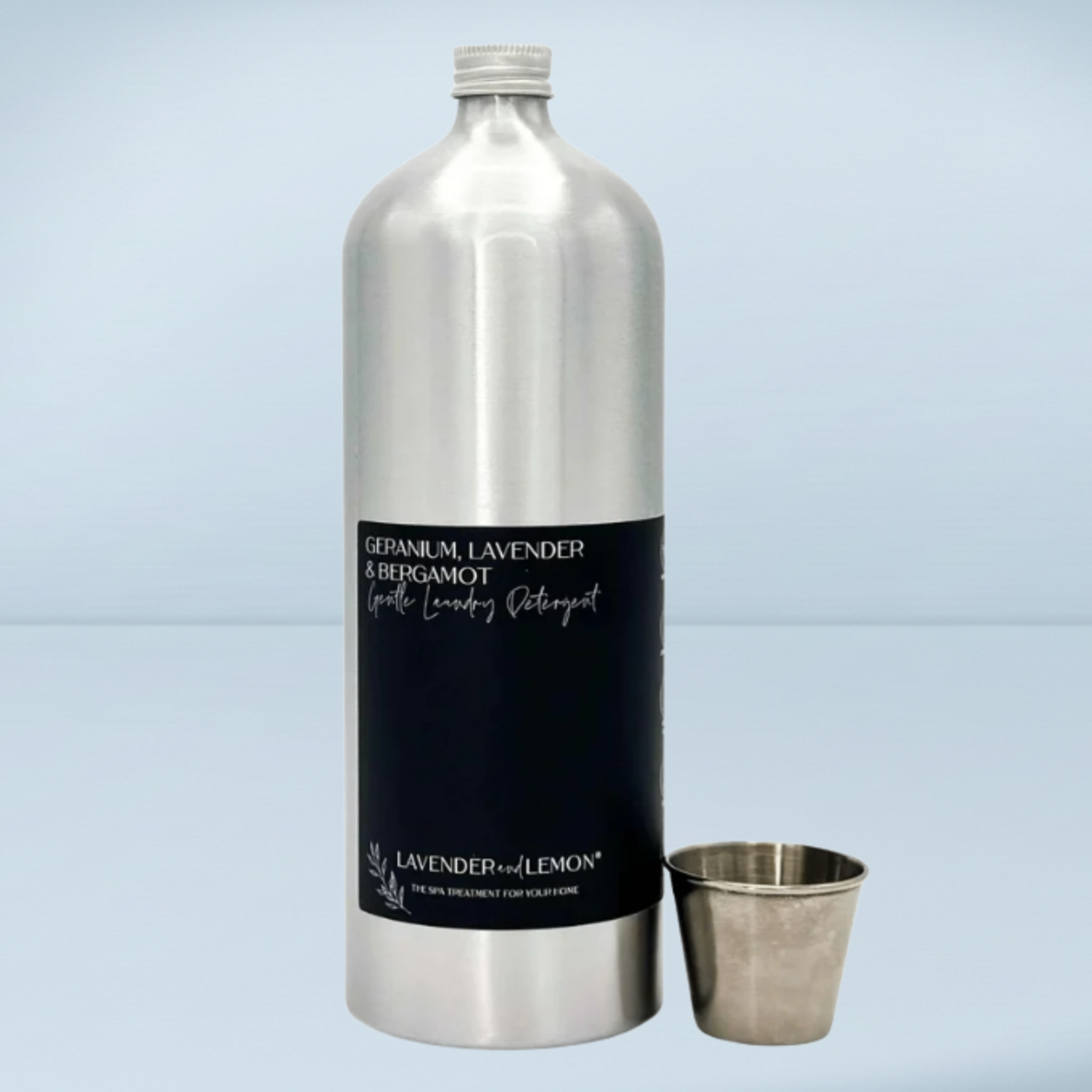 a silver metal bottle of detergent