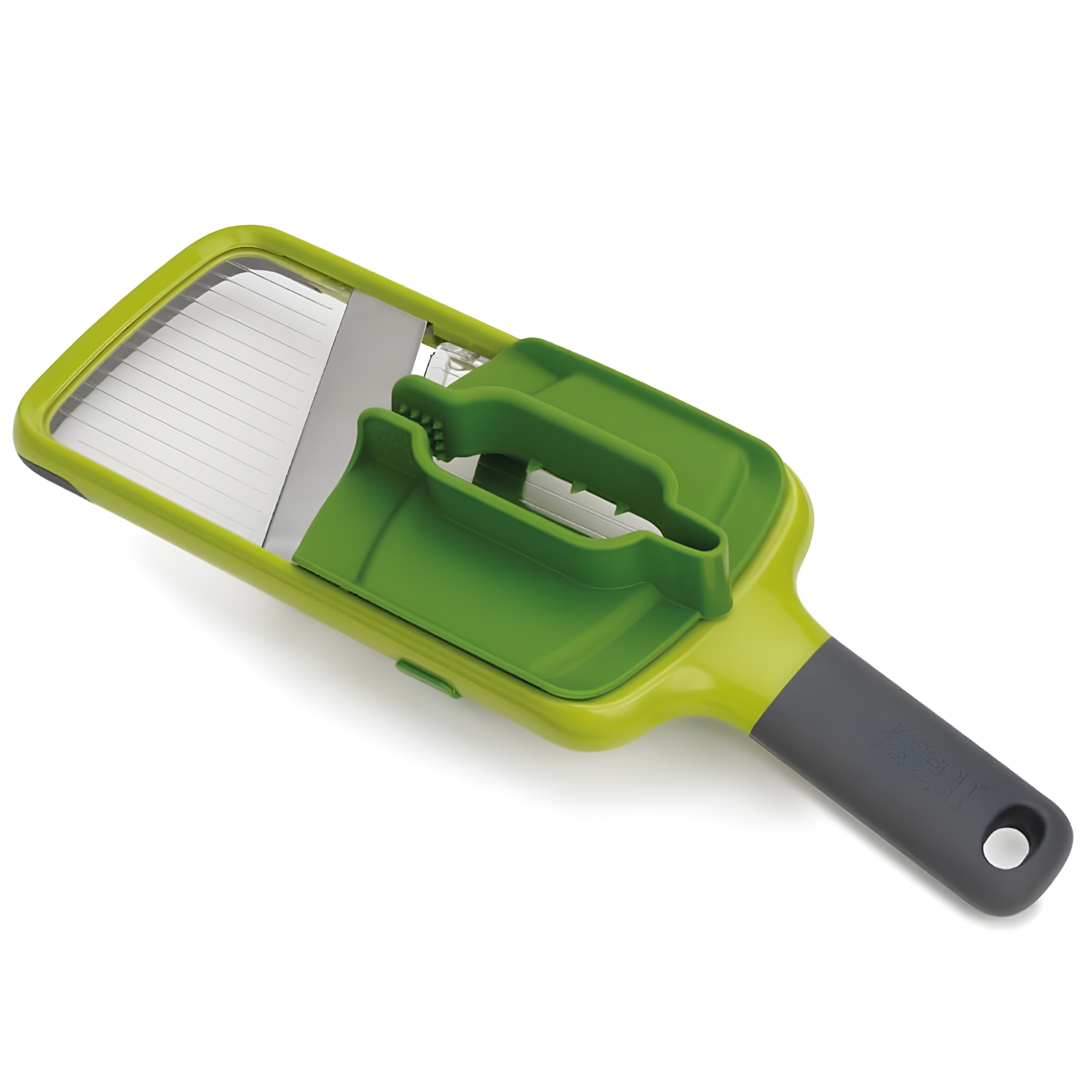 a green handheld kitchen mandoline