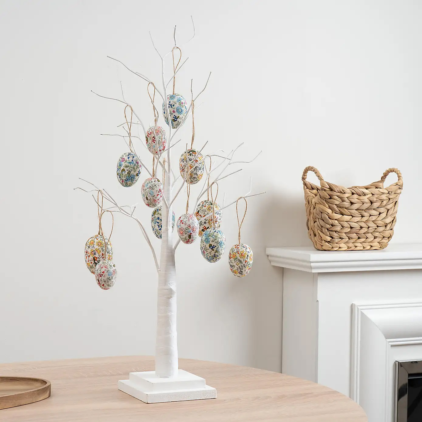 white twig tree with 12 floral hanging egg decorations