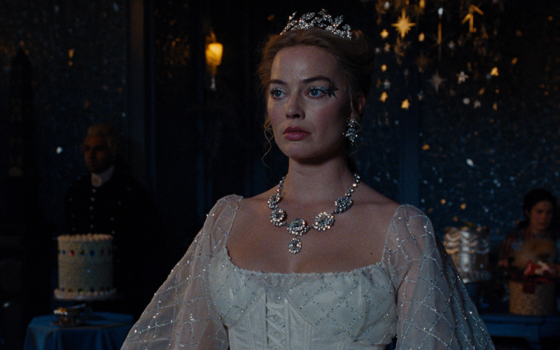 Margot Robbie in a white dress as Cathy in Wuthering Heights