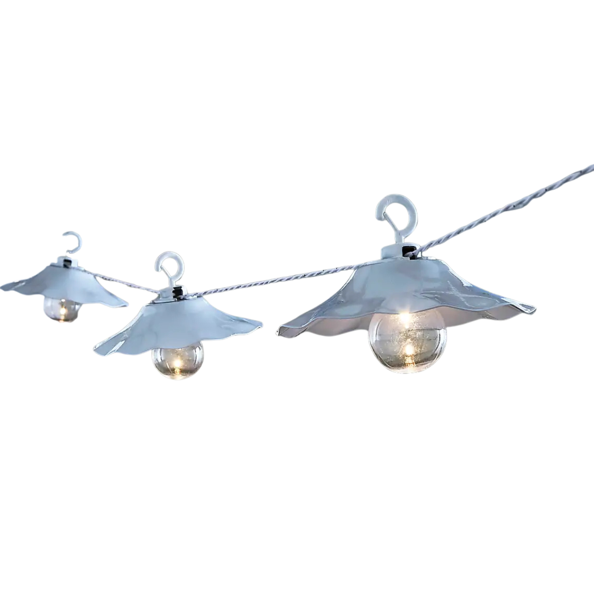 a strong of three white scalloped outdoor lights