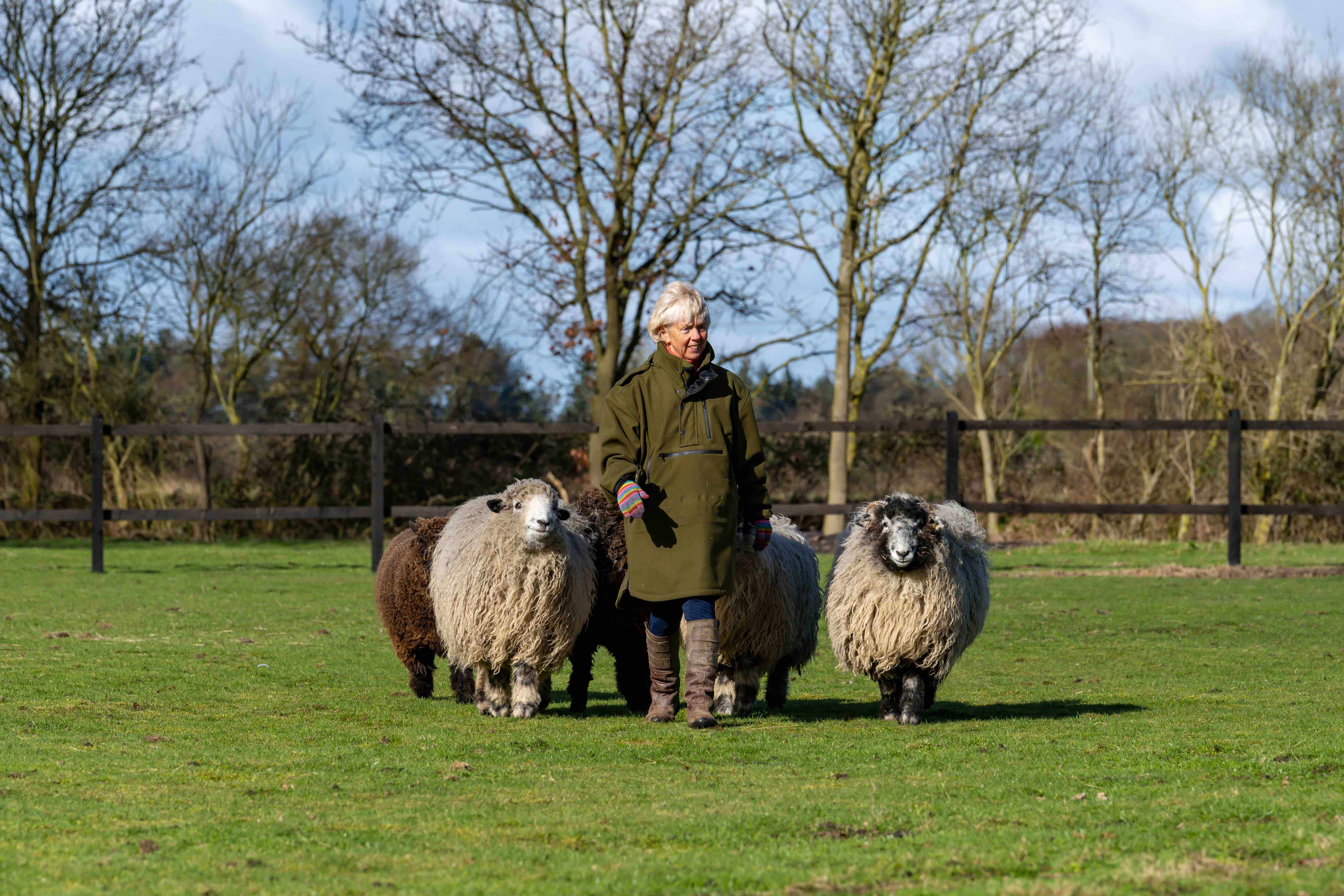 Iron & Brass Bed Company founder Amanda Oldfield in the field with her sheep