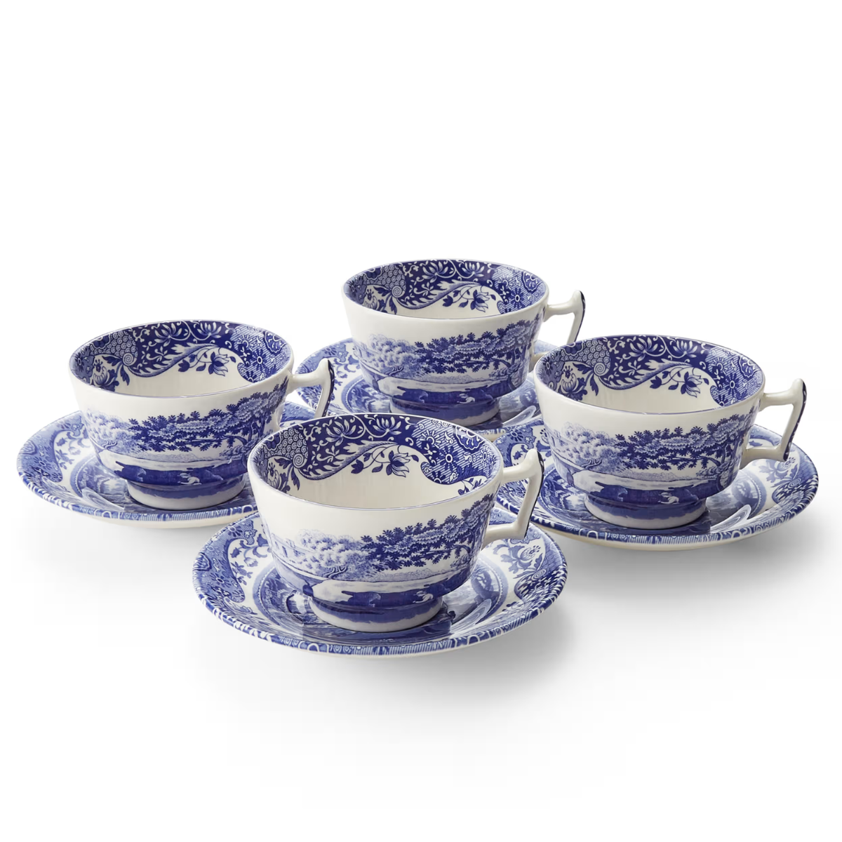 set of 4 blue and white patterned teacups and saucers